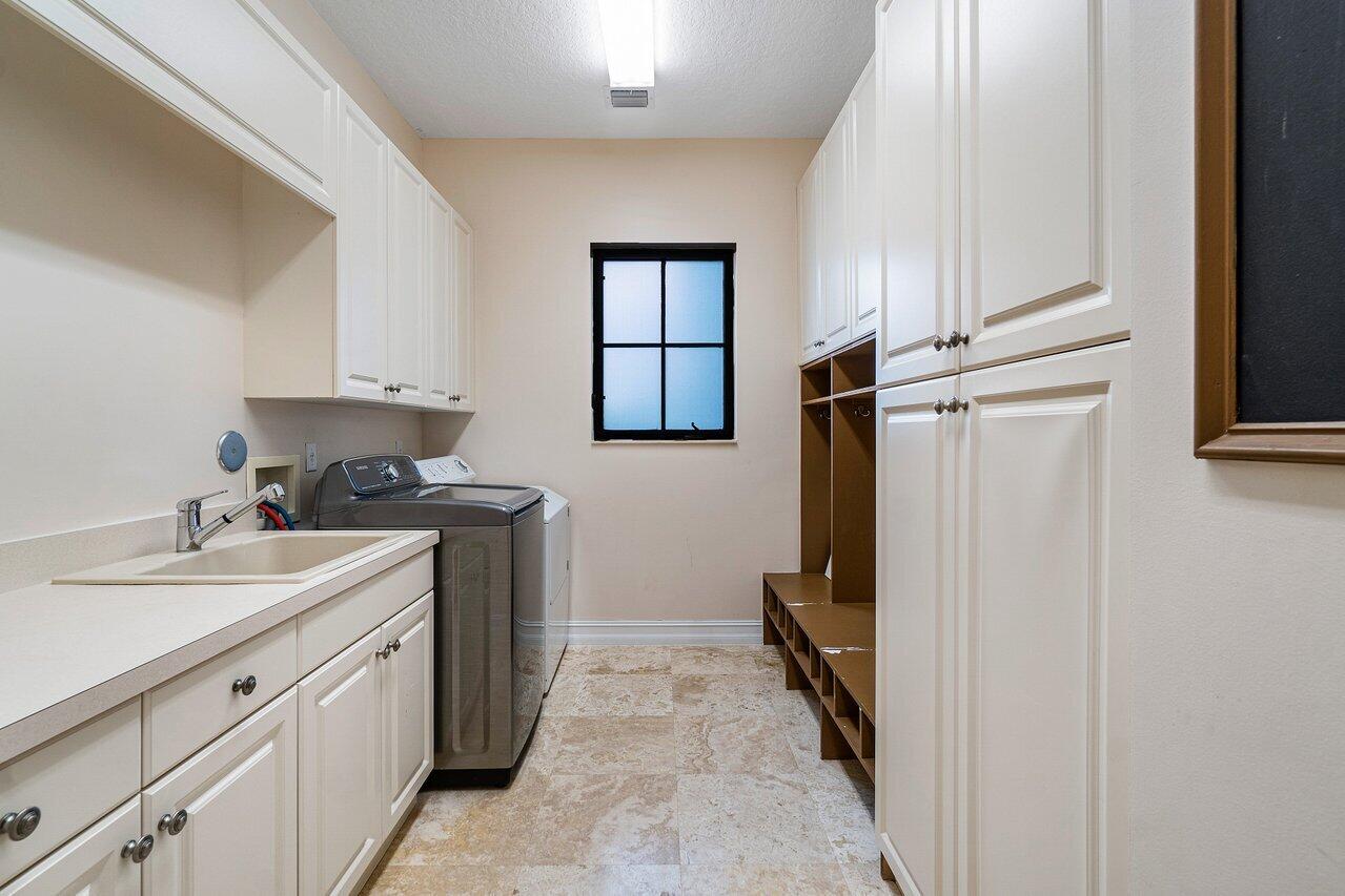 9636 Bridgebrook Drive Boca Raton, FL 33496 - Photo 9 of 50 a kitchen with a sink and refrigerator