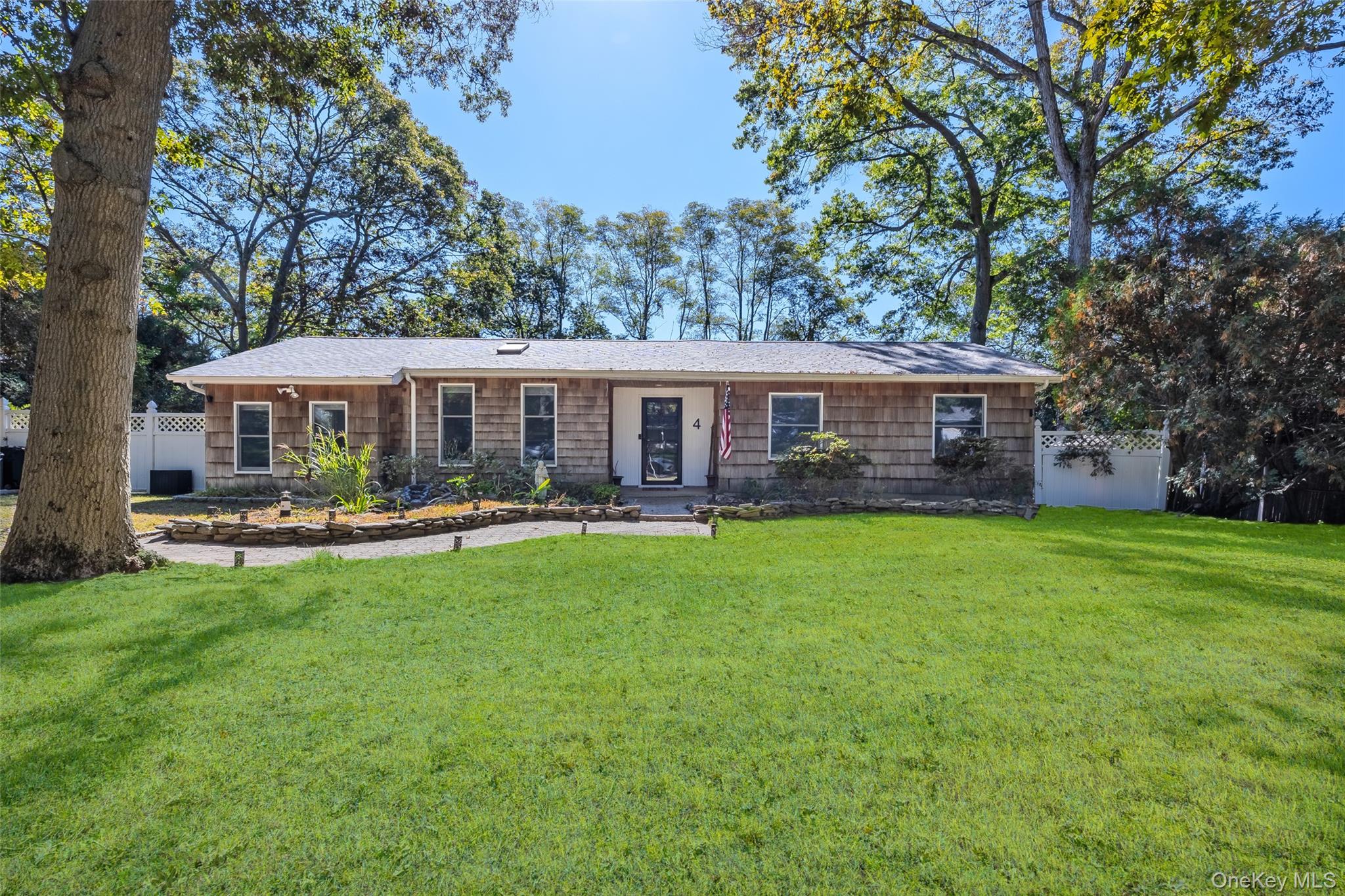 a view of a house with pool and a yard