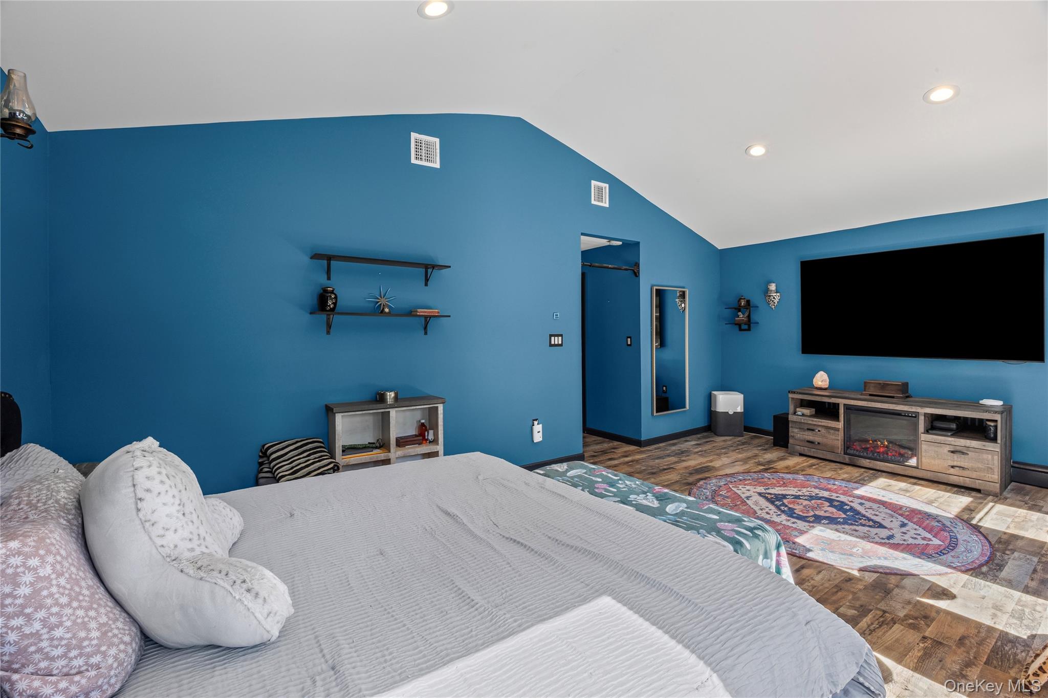 4 Model Court Rocky Point, NY 11778 - Photo 21 of 36 a bedroom with a bed and a flat screen tv