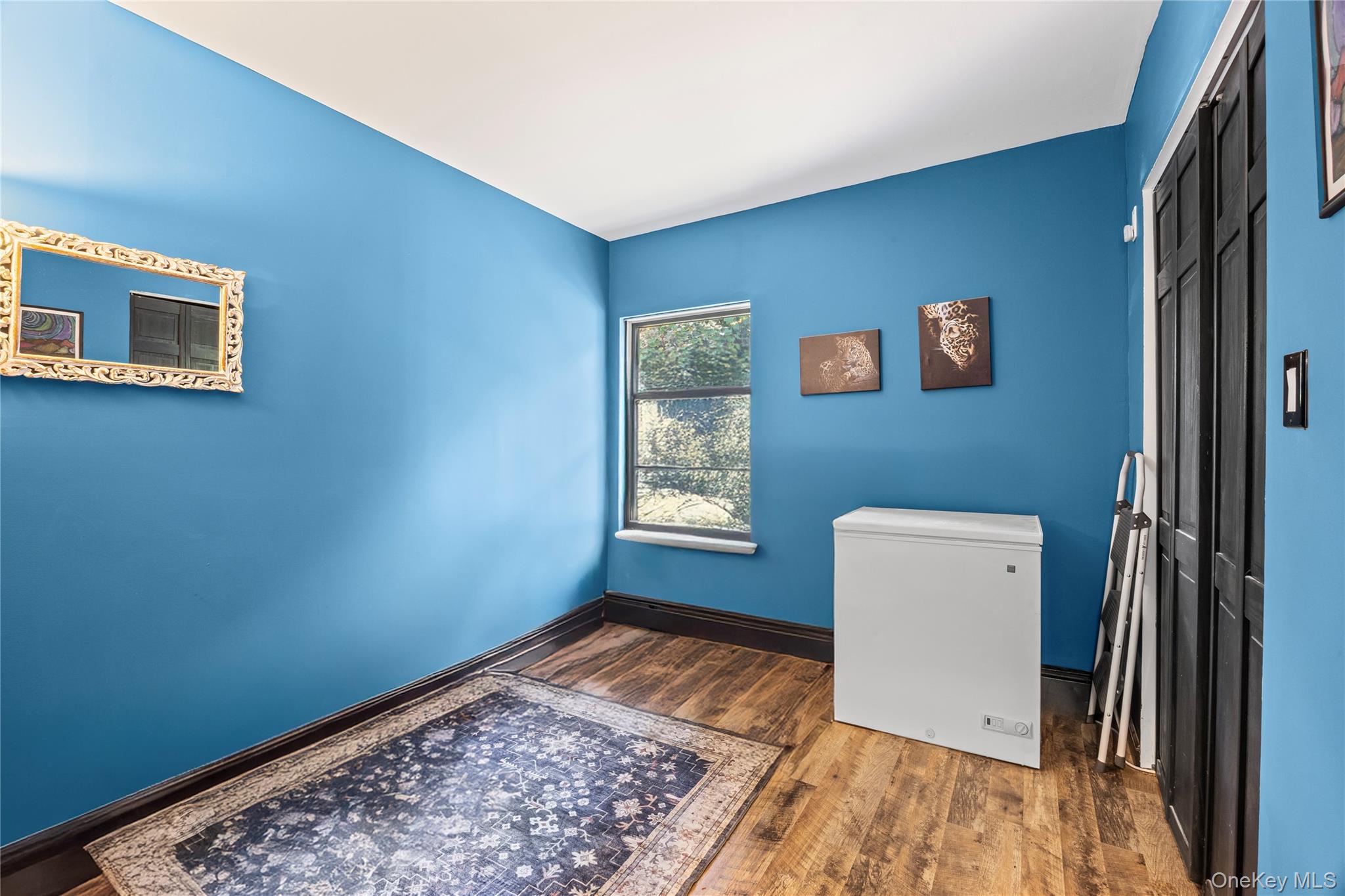 4 Model Court Rocky Point, NY 11778 - Photo 27 of 36 a view of an empty room and a window