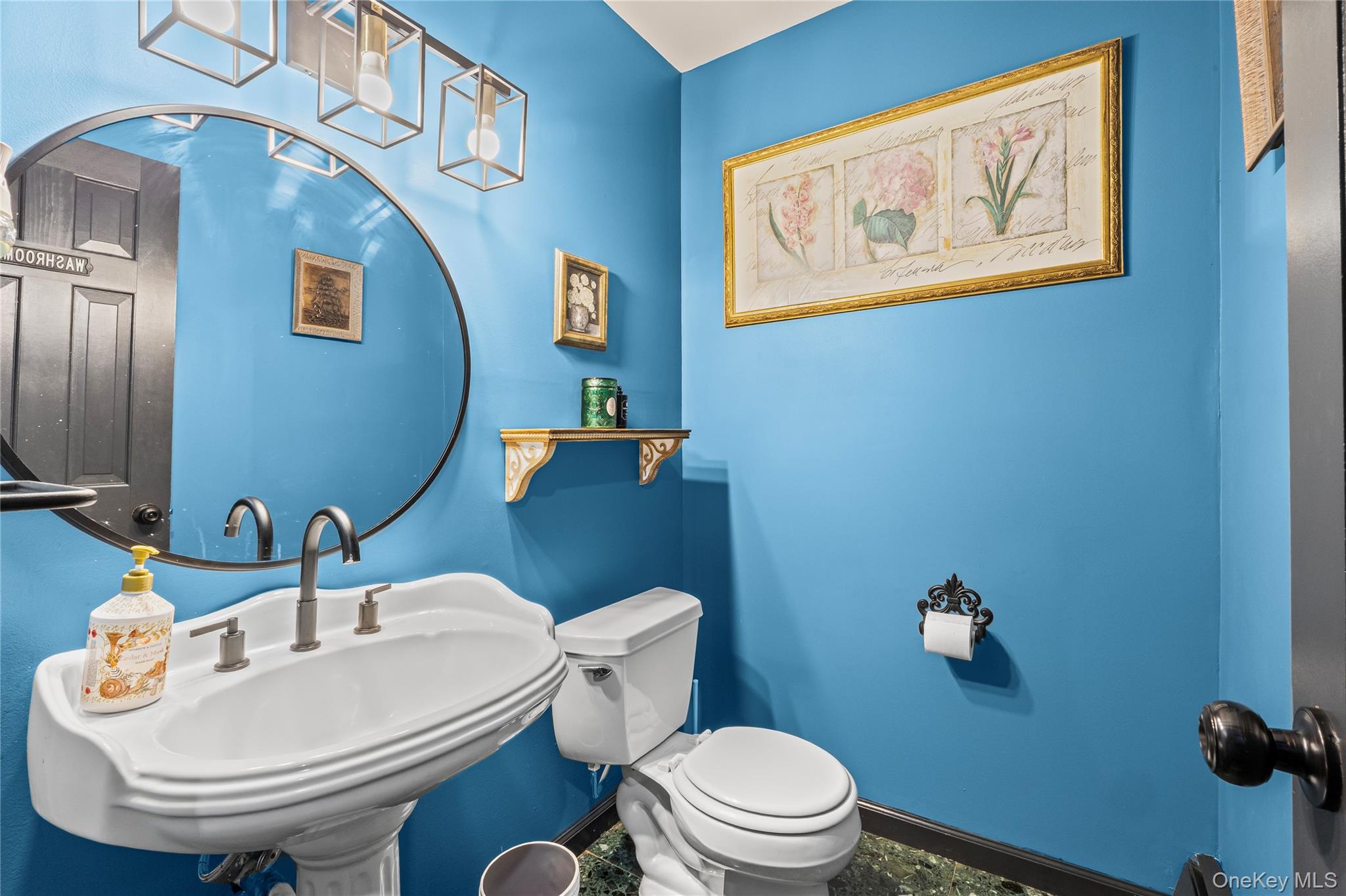 4 Model Court Rocky Point, NY 11778 - Photo 29 of 36 a bathroom with a toilet a sink and mirror