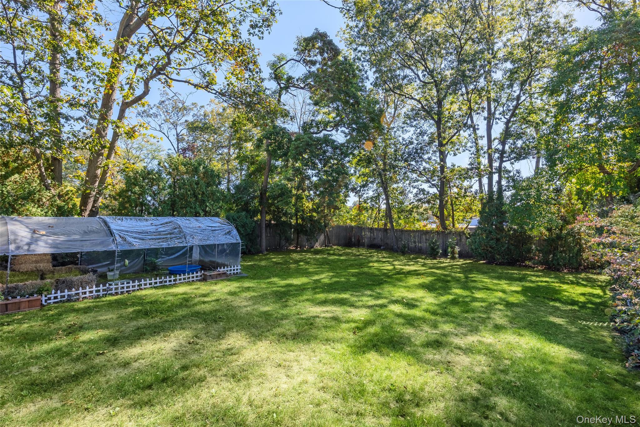 4 Model Court Rocky Point, NY 11778 - Photo 33 of 36 a view of a house with a big yard