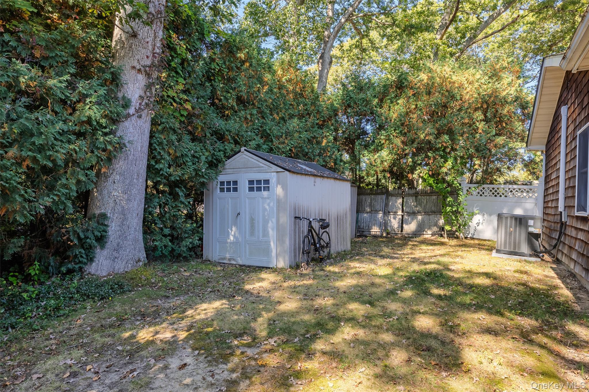 4 Model Court Rocky Point, NY 11778 - Photo 35 of 36 a view of a barn in the middle of a yard