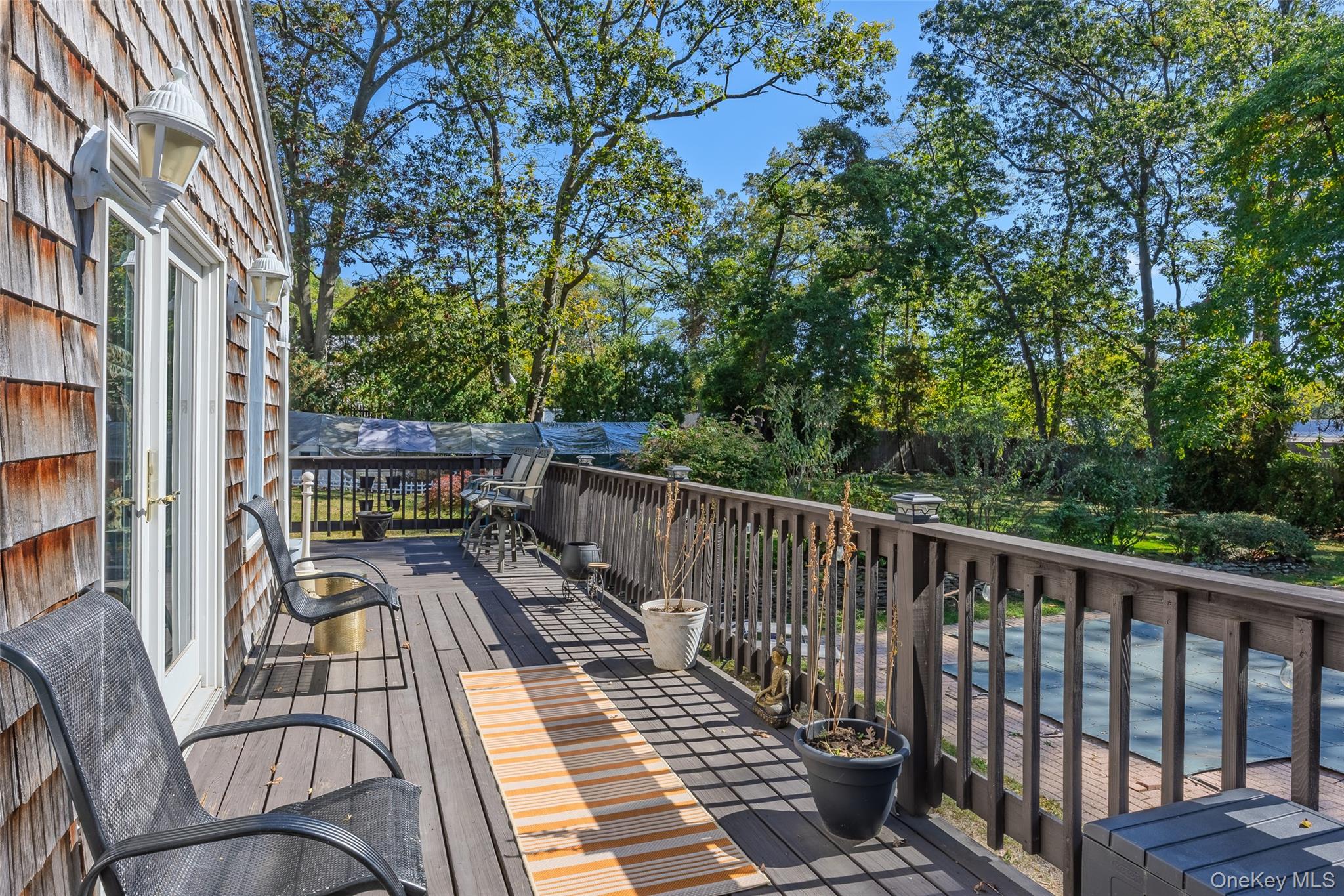 4 Model Court Rocky Point, NY 11778 - Photo 36 of 36 a view of balcony with wooden floor and outdoor seating