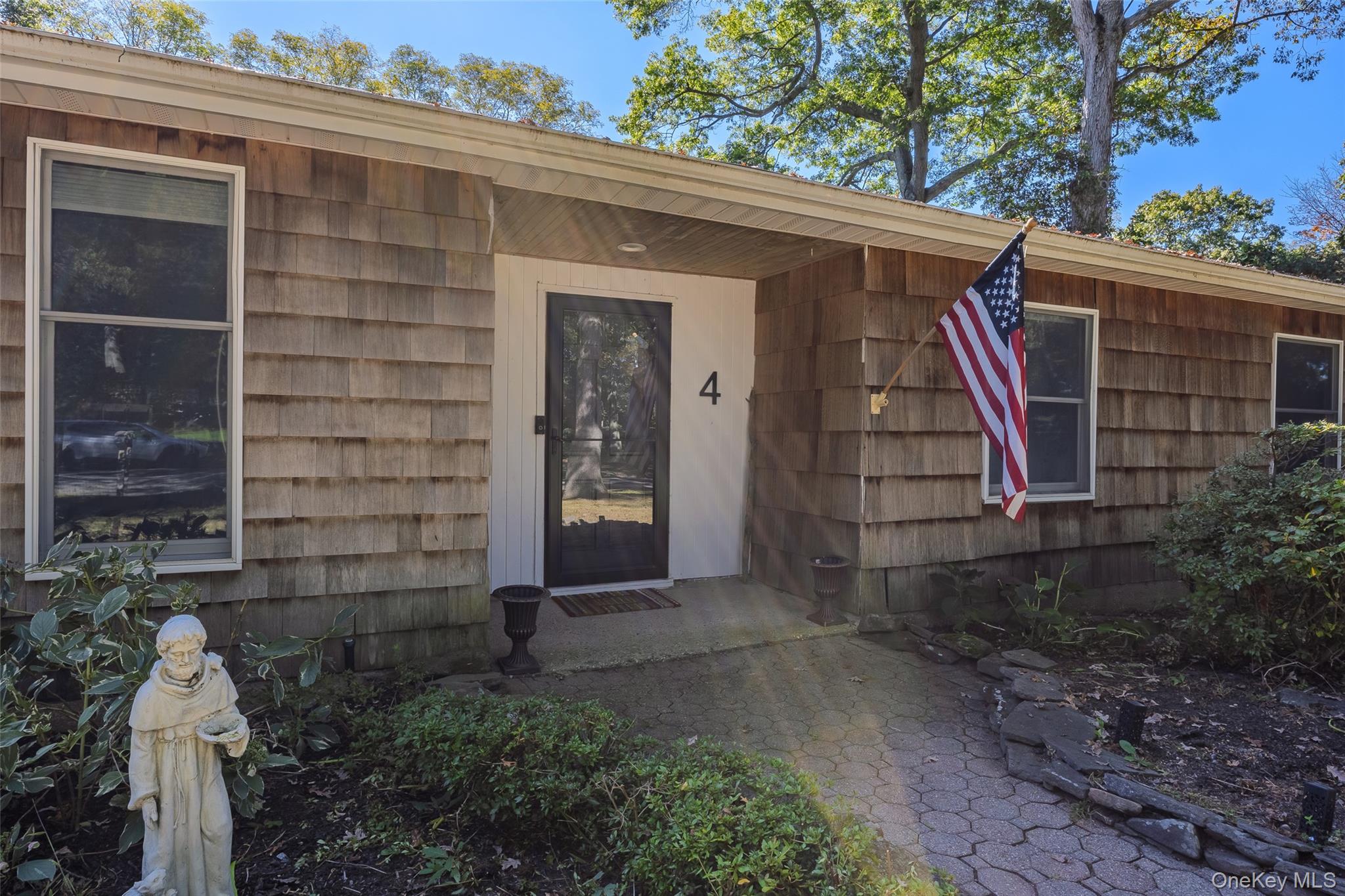 4 Model Court Rocky Point, NY 11778 - Photo 7 of 36 a view of front door and potted plants