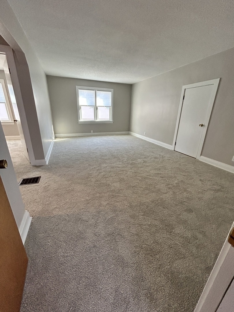 461 North Northwest Highway, Unit 2 Park Ridge, IL 60068 - Photo 7 of 17 a view of livingroom with hardwood floor and window