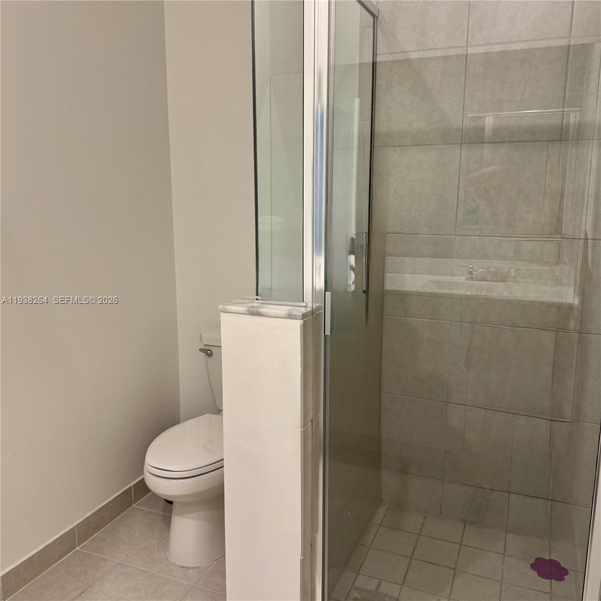 23049 Southwest 129th Place Miami, FL 33177 - Photo 21 of 29 a white toilet sitting next to a bathroom sink