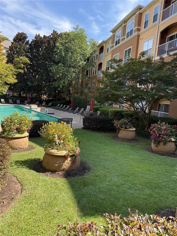 10 Perimeter Summit Boulevard, Unit 3201 Brookhaven, GA 30319 - Photo 17 of 27 a front view of a house with a garden and seating area