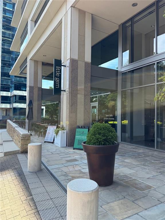 10 Perimeter Summit Boulevard, Unit 3201 Brookhaven, GA 30319 - Photo 25 of 27 a view of a house with potted plants