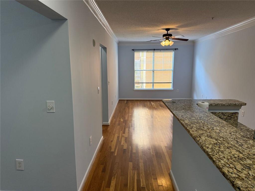 10 Perimeter Summit Boulevard, Unit 3201 Brookhaven, GA 30319 - Photo 3 of 27 a view of kitchen and wooden floor