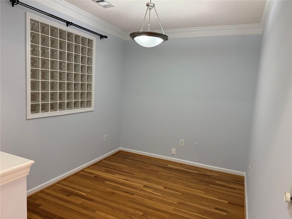 10 Perimeter Summit Boulevard, Unit 3201 Brookhaven, GA 30319 - Photo 6 of 27 a view of a room with wooden floor and white walls
