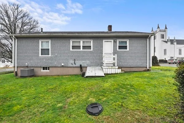 a backyard of a house with barbeque oven