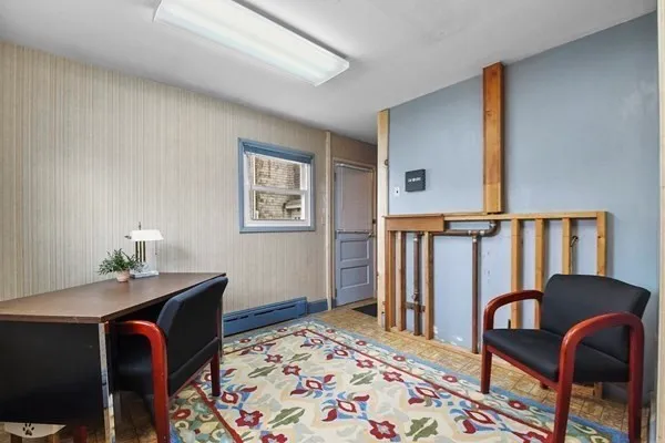 a workspace with furniture and window