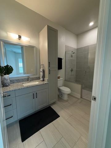 930 Ridgeview Drive, Unit 1273 Allen, TX 75013 - Photo 24 of 28 a spacious bathroom with a double vanity sink a toilet and a shower