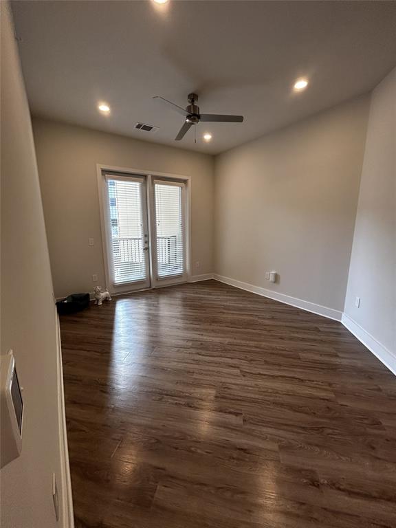 930 Ridgeview Drive, Unit 1273 Allen, TX 75013 - Photo 27 of 28 an empty room with wooden floor and windows