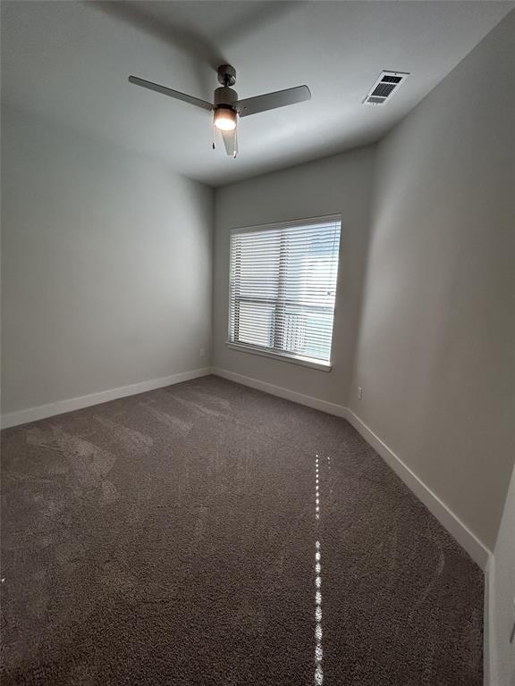 930 Ridgeview Drive, Unit 1273 Allen, TX 75013 - Photo 28 of 28 an empty room with a empty space and windows