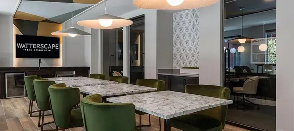 a kitchen with a table and chairs in it