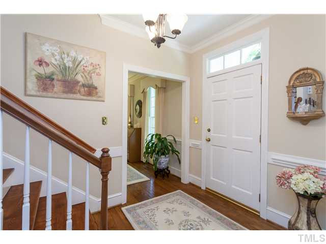 12405 Whartons Way Raleigh, NC 27613 - Photo 2 of 23 WELCOME GUESTS IN THIS BRIGHT AND OPEN FOYER WITH BEAUTIFUL STAIRCASE AND GLOWING HARDWOODS. Foyer