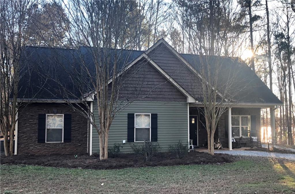 561 Grove Level Road Commerce, GA 30529 - Photo 1 of 1 a front view of a house with garden
