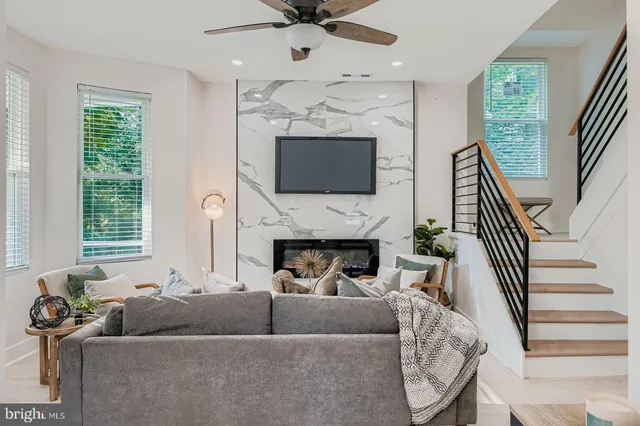 a view of living room with furniture and a mirror