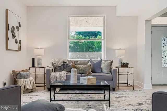 a view of a dining room with furniture and window