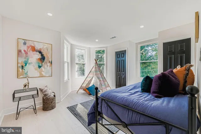 a view of a livingroom with furniture and a flat screen tv