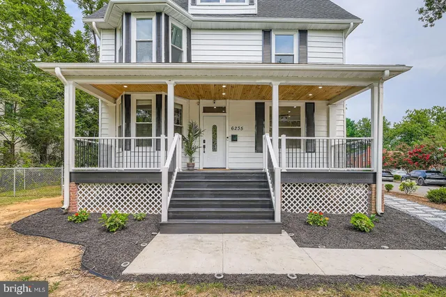 a view of balcony with wooden floor