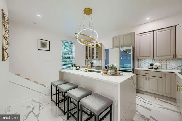 a kitchen with sink cabinets and window