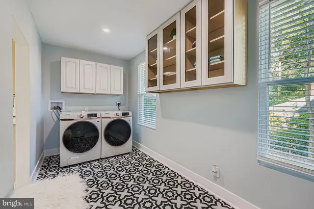 a bathroom with a bathtub sink and mirror