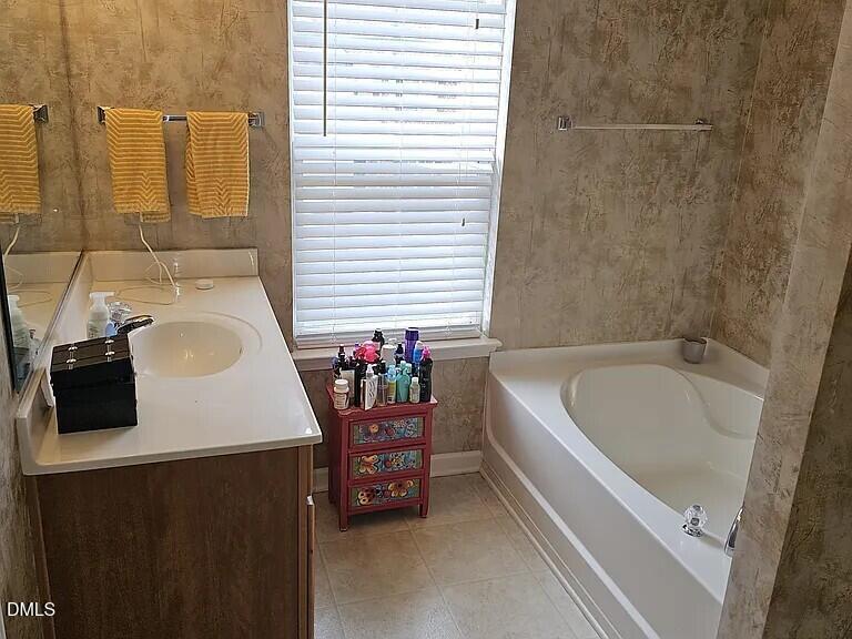 4602 Peyton Hall Way Raleigh, NC 27604 - Photo 11 of 17 a bathroom with a bathtub and a sink