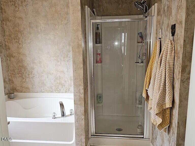 4602 Peyton Hall Way Raleigh, NC 27604 - Photo 12 of 17 a bathroom with a bathtub and shower
