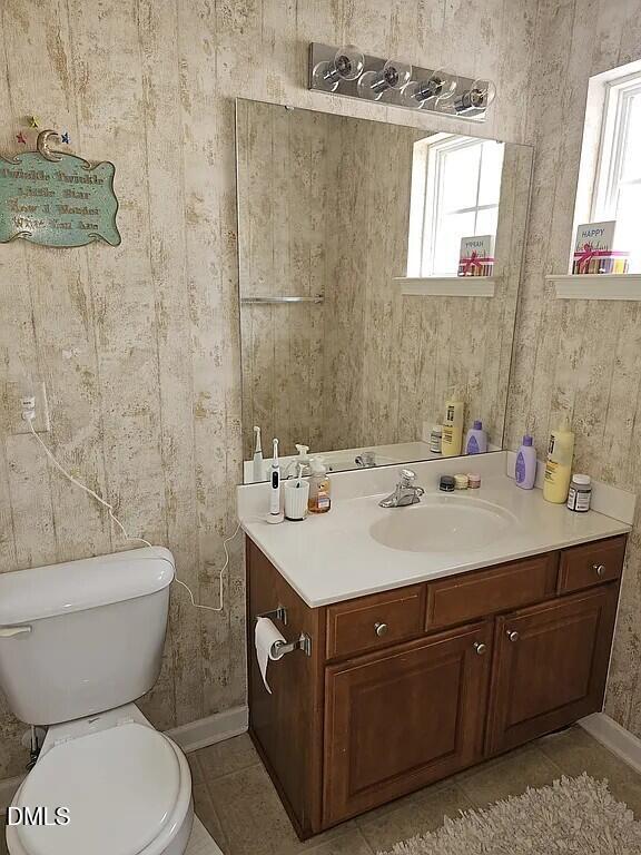 4602 Peyton Hall Way Raleigh, NC 27604 - Photo 14 of 17 a bathroom with a sink toilet and mirror