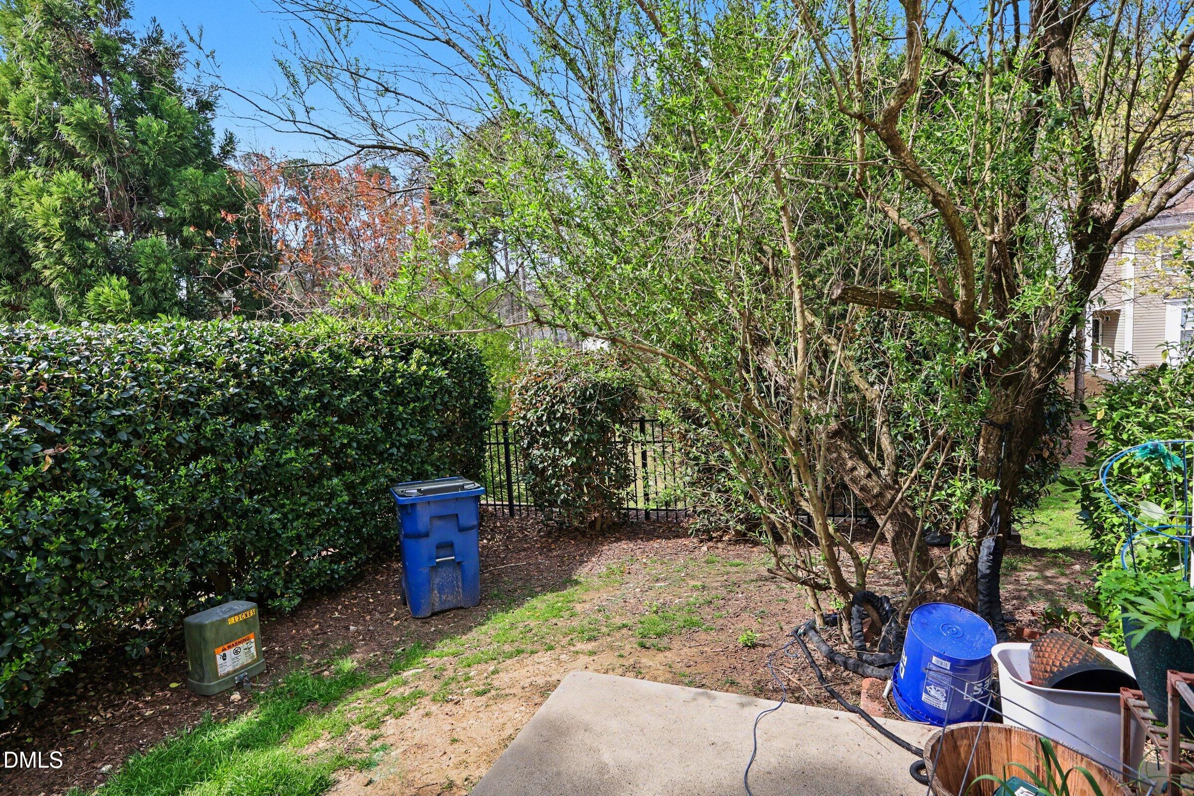 4602 Peyton Hall Way Raleigh, NC 27604 - Photo 16 of 17 a view of a bench in the backyard