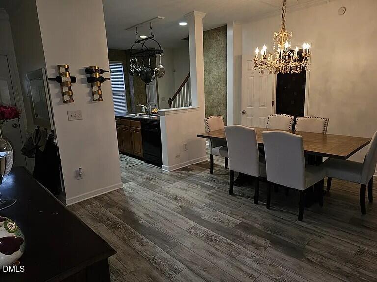 4602 Peyton Hall Way Raleigh, NC 27604 - Photo 6 of 17 a view of a dining room with furniture and chandelier