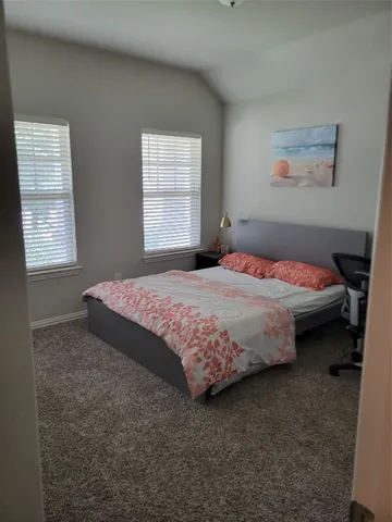 a bathroom with a granite countertop sink a toilet and shower