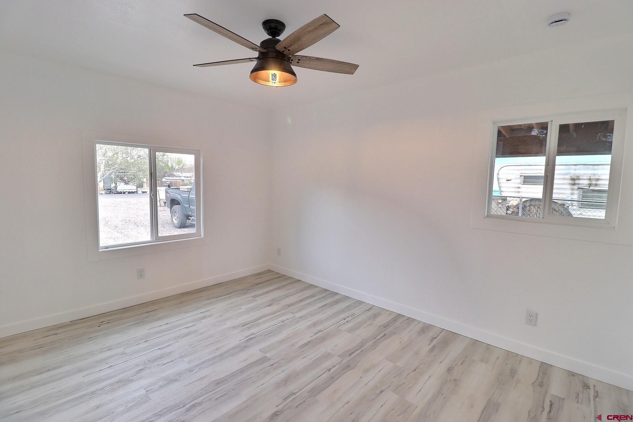 525 Sloan Street Delta, CO 81416 - Photo 17 of 26 wooden floor in an empty room with a window