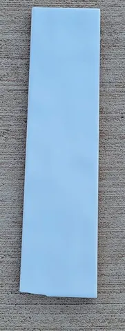 a view of a hallway with wooden walls