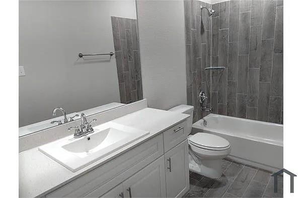 4254 Calla Drive Forney, TX 75126 - Photo 6 of 7 a bathroom with a sink toilet and shower