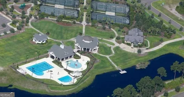 an aerial view of a house with outdoor space