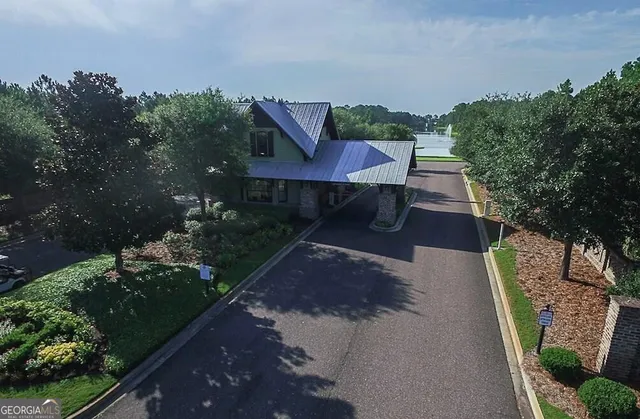 an aerial view of a house with a lake view