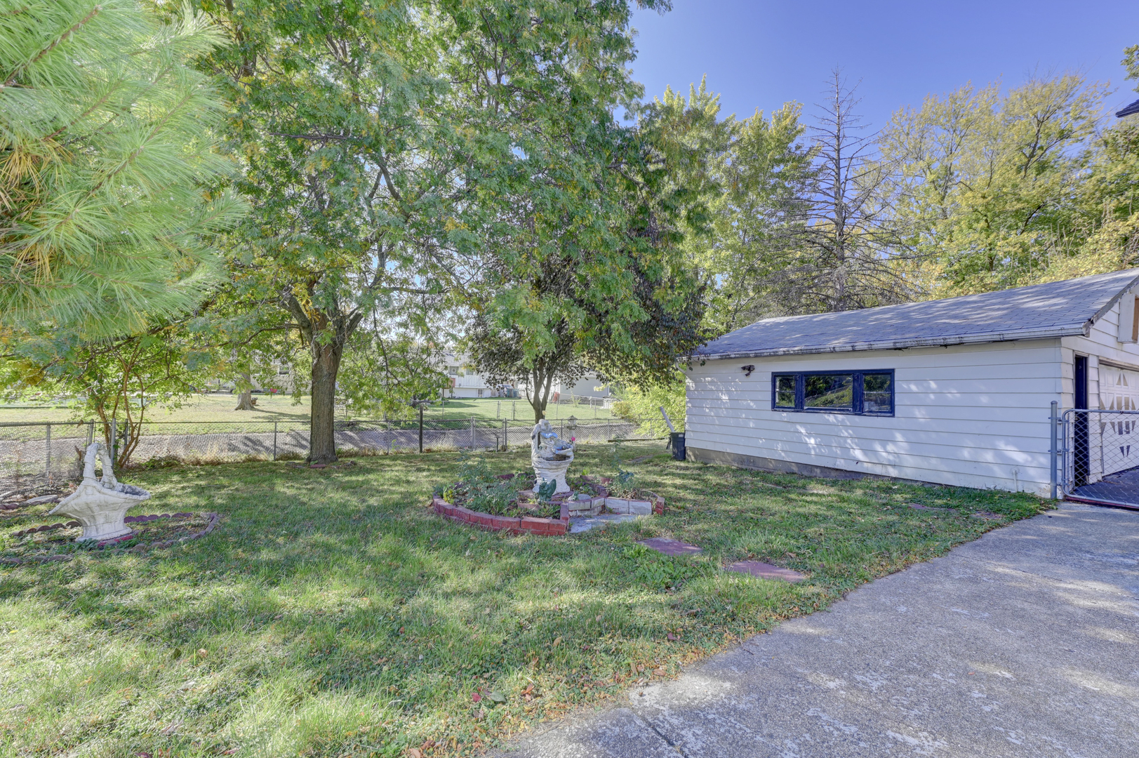 2602 Fairway Drive Joliet, IL 60435 - Photo 17 of 20 a view of a yard in front of a house with a tree