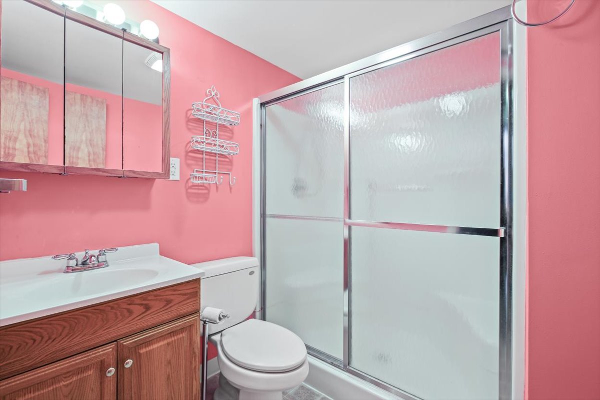 1513 Gates Drive Rantoul, IL 61866 - Photo 26 of 37 a bathroom with a granite countertop shower sink vanity mirror and toilet