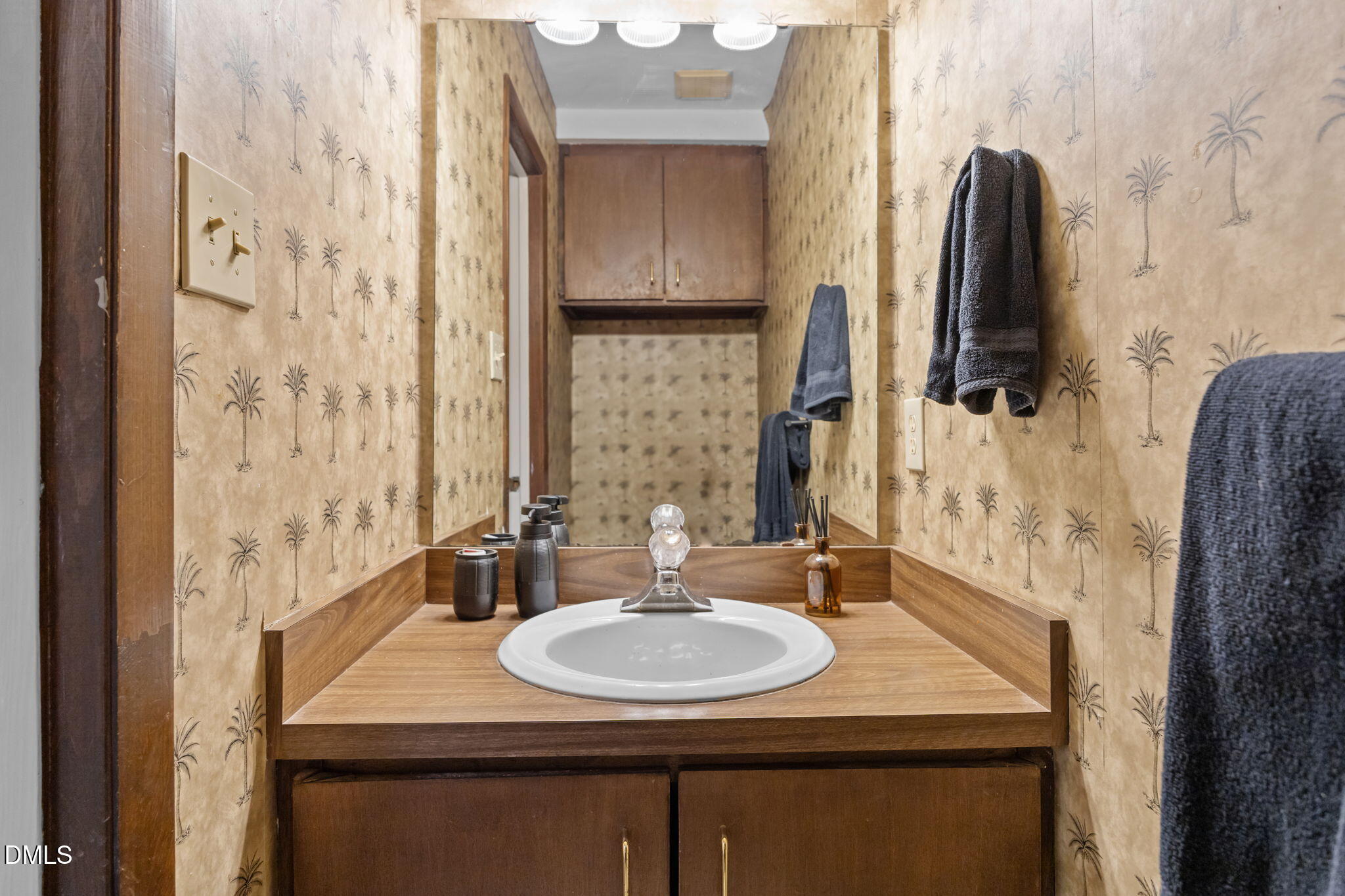1108 Hemingway Drive Raleigh, NC 27609 - Photo 29 of 68 a bathroom with a sink and a mirror