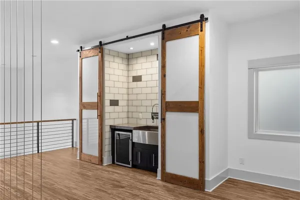 a view of livingroom with hardwood floor and hallway