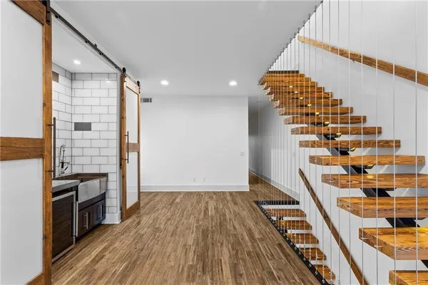 a view of wooden floor and windows in a room