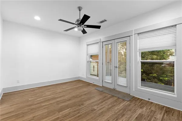 wooden floor in an empty room with a window