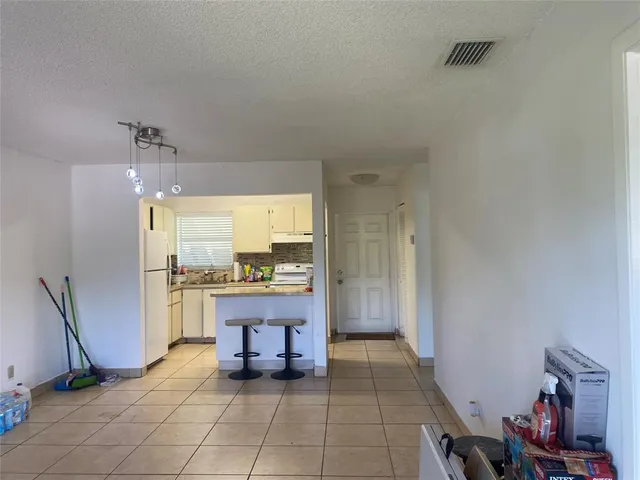 a room with table and chairs