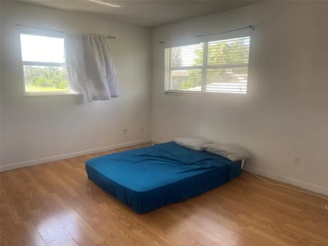 a room with window and a wooden floor