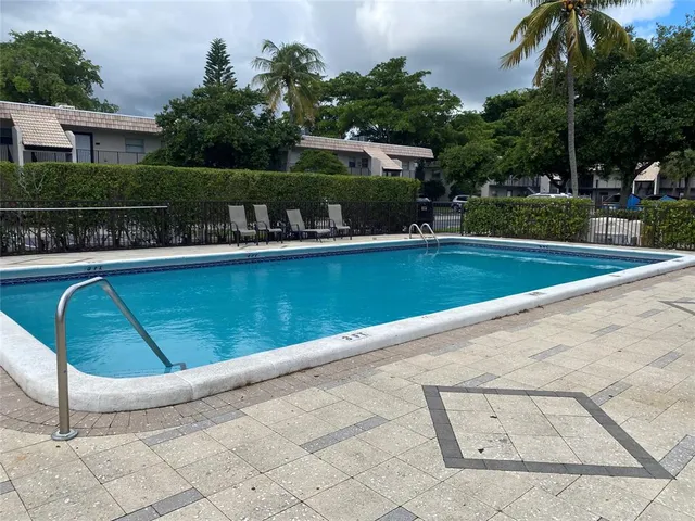 a view of a swimming pool with a patio
