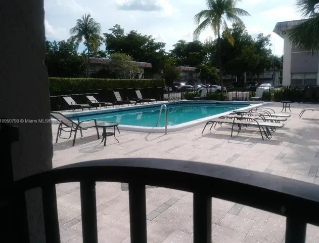 a view of a lake with outdoor seating